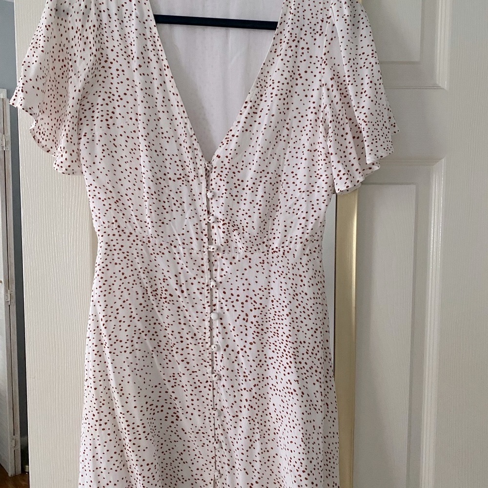 White petite dress with small red polka dots. Low cut button up; worn 3x